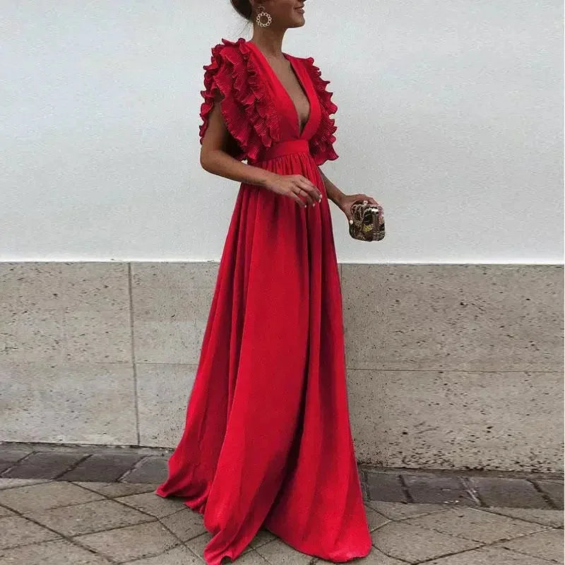 Red Women's Flutter Sleeve Flowy Maxi Dress — Delaney Deep V-Neck Ruffle - Outdoor Pose