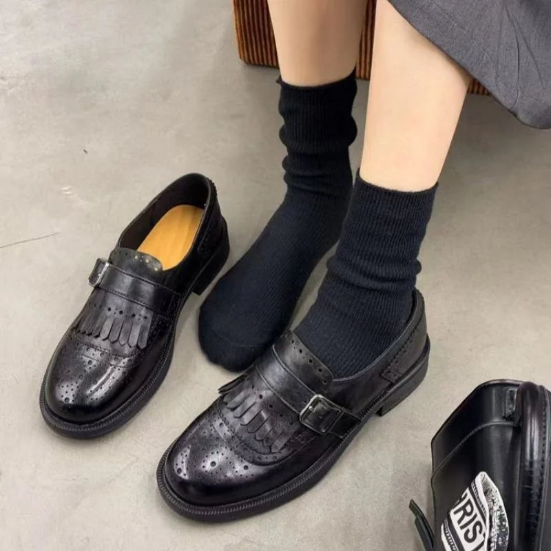 Black single strap with buckle Women's Brogue Loafers with Fringed Detail & Cushioned Comfort - Close Up Paired Feet