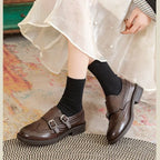 Brown Women's Brogue Loafers with Fringed Detail & Cushioned Comfort - Seated Skirt Pose