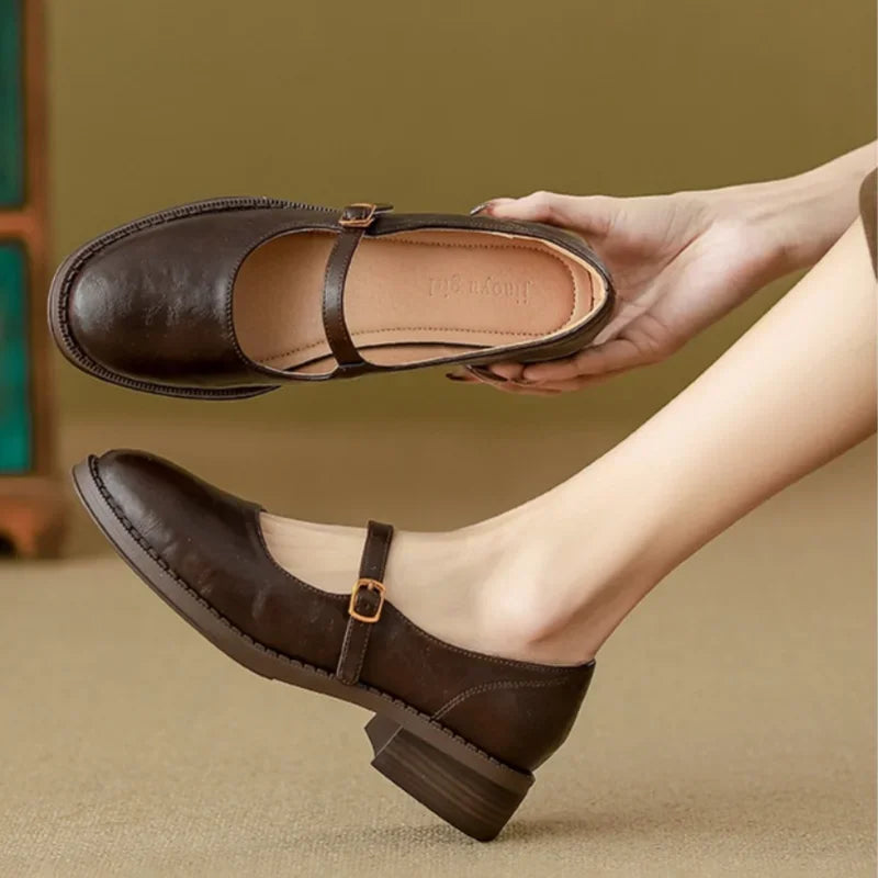 Brown Women's Leather Mary Janes — Maisie Buckle-Strap Round-Toe Block Heel - Hand Hold Sole View