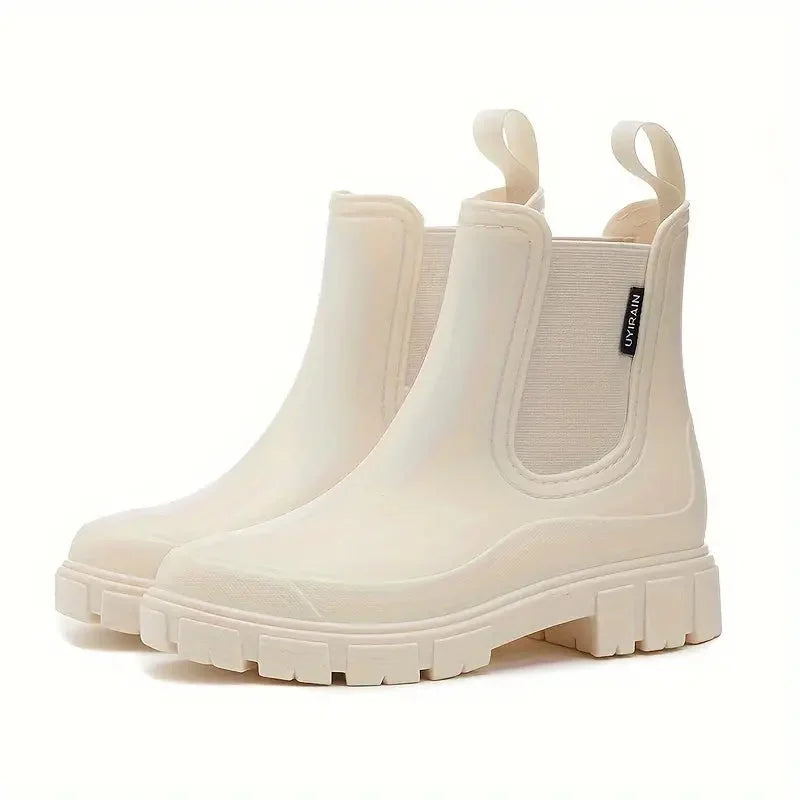 Beige Women's Waterproof Rain Boots — Kennedy Slip-On Lug-Sole Pull-Tab - Studio White Pair