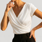 White Women's Draped Wrap Front Blouse with Cap Sleeves & Relaxed Fit — Petra - Side Pose Hand