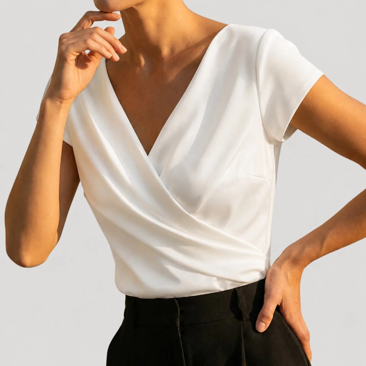 White Women's Draped Wrap Front Blouse with Cap Sleeves & Relaxed Fit — Petra - Side Pose Hand