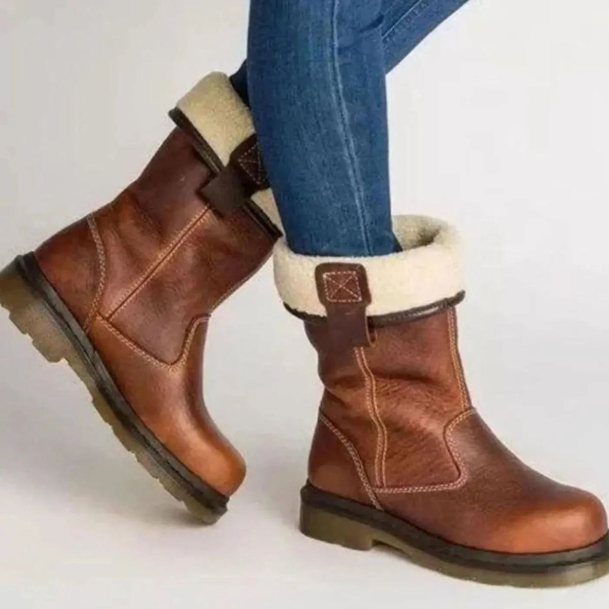 Brown Women's Leather Winter Boots with Fleece-Lined Cuff & Slip-On Fit - Side Pose Walking