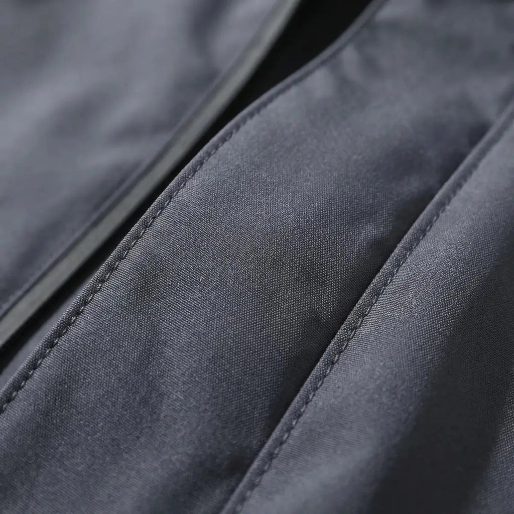 Gray Men's Hooded Waterproof Rain Coat — Andie Everyday Windproof Zip-Up - Fabric Close Up