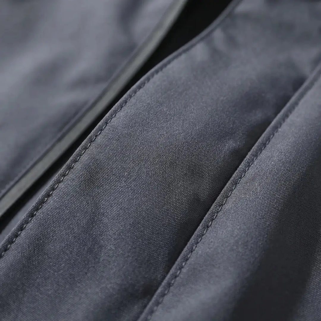 Gray Men's Hooded Waterproof Rain Coat — Andie Everyday Windproof Zip-Up - Fabric Close Up