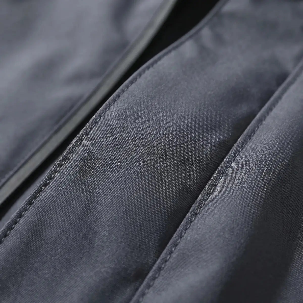 Gray Men's Hooded Waterproof Rain Coat — Andie Everyday Windproof Zip-Up - Fabric Close Up