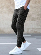Black Men's Plaid Jogger Trousers with Drawstring Waist & Tapered Cuff - Front Standing Pose