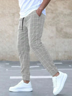 Men's Plaid Jogger Trousers with Drawstring Waist & Tapered Cuff - Side Stride View