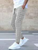 Men's Plaid Jogger Trousers with Drawstring Waist & Tapered Cuff - Side Walking Motion