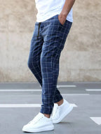 Men's Plaid Jogger Trousers with Drawstring Waist & Tapered Cuff - Side Walking Pose