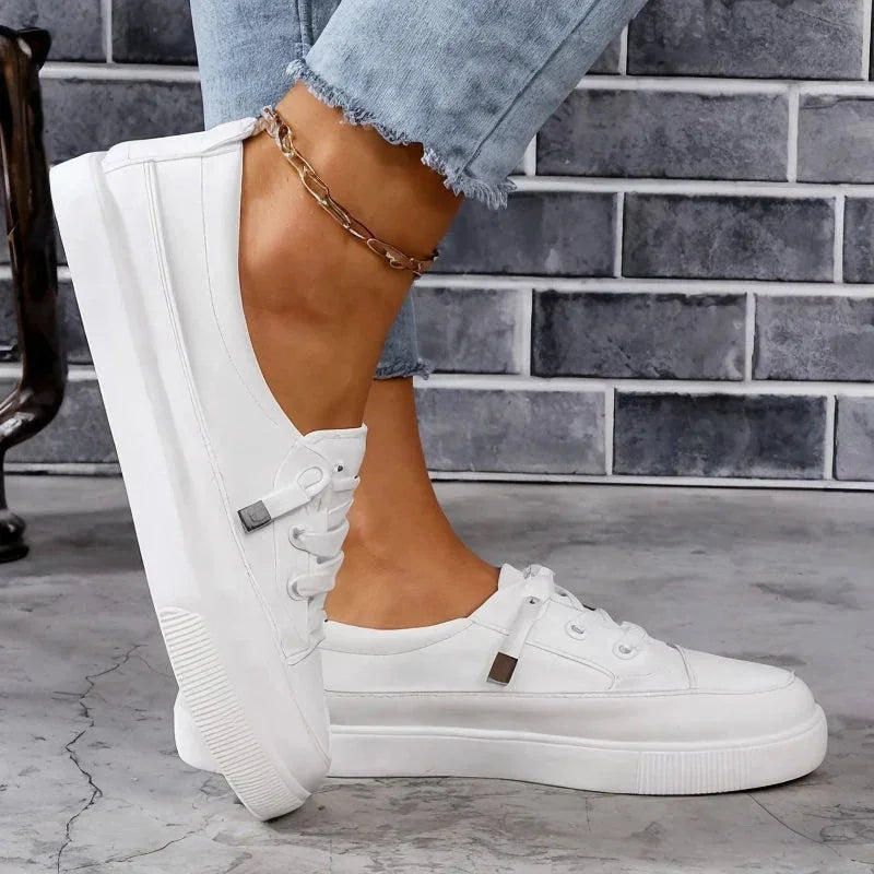 White Women's Low Top Leather Sneakers with Lace-Up Closure — Monroe - Side Profile Worn