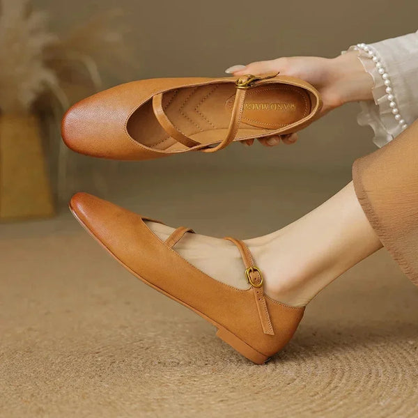 Brown Women's Crisscross Leather Flats — Jasmine Butter-Soft Mary Buckle - Hand Holding Shoe