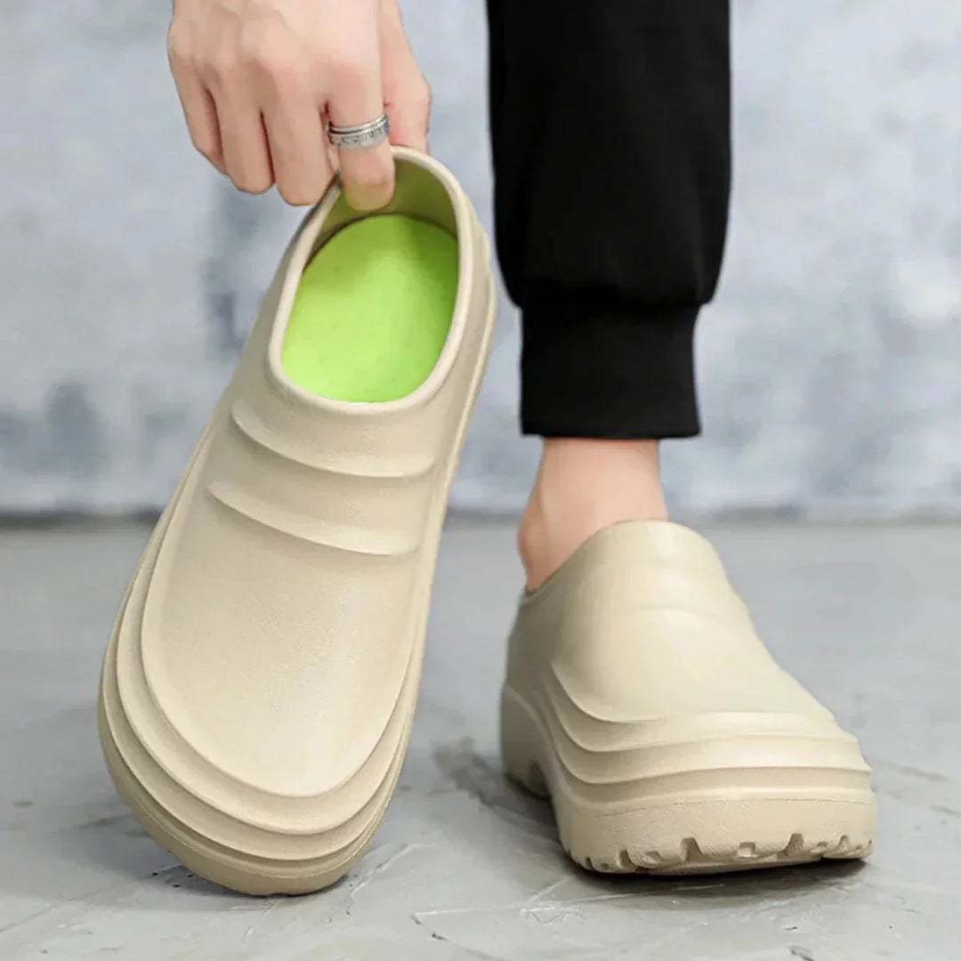 Beige Unisex Platform Orthopedic Waterproof Clogs — Edie Slip-On Non-Slip Cushioned - Hand Holding Shoe