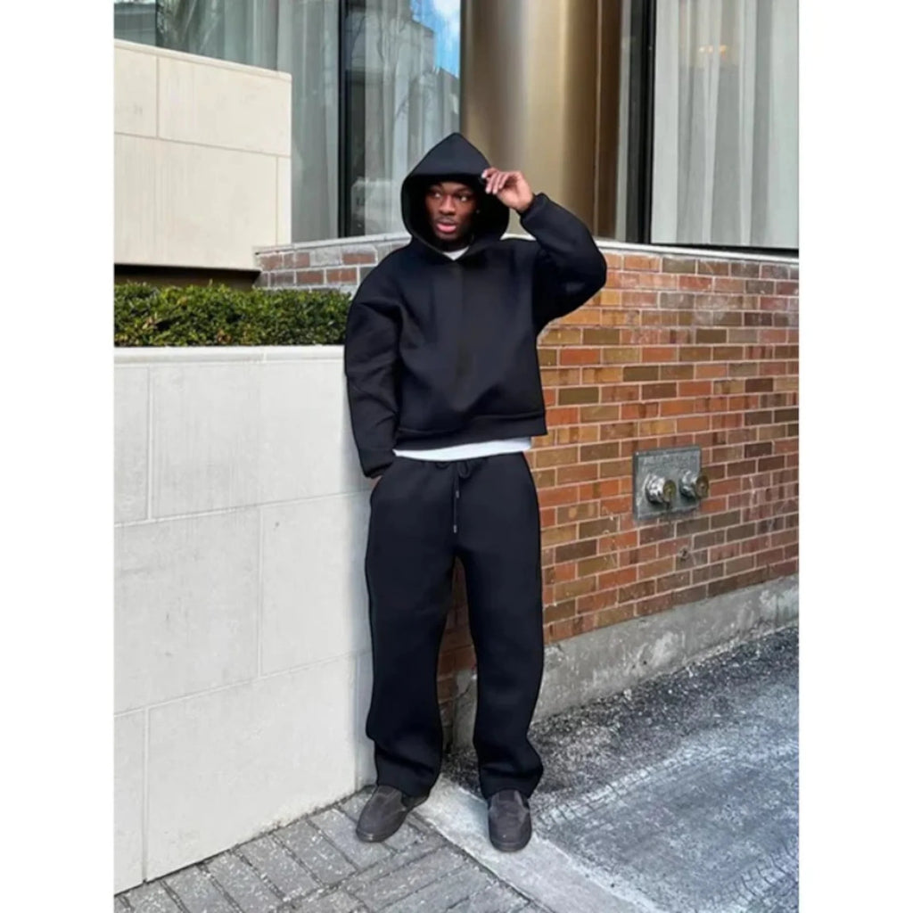 Men's Oversized Tracksuit with Drawstring Hood & Ribbed Cuffs - Front Pose Wall