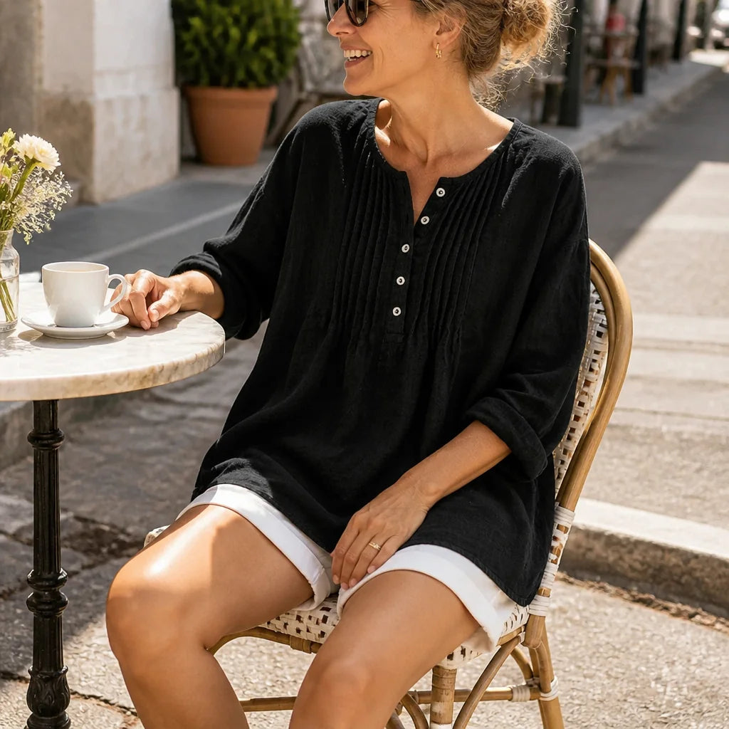 Black Women's Loose Fit Tunic Blouse with Pin-Tuck Pleats & Button-Front Placket — Lila - Seated Cafe Table