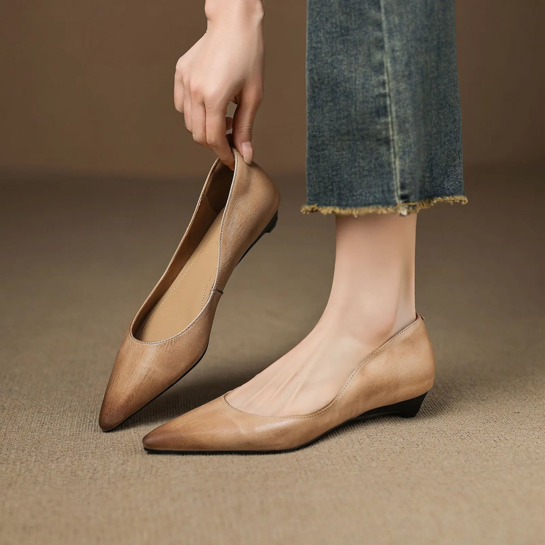 Apricot Women's Pointed Toe Leather Flats — Marielle Cushioned Wedge Heel - Hand Holding Shoe Worn