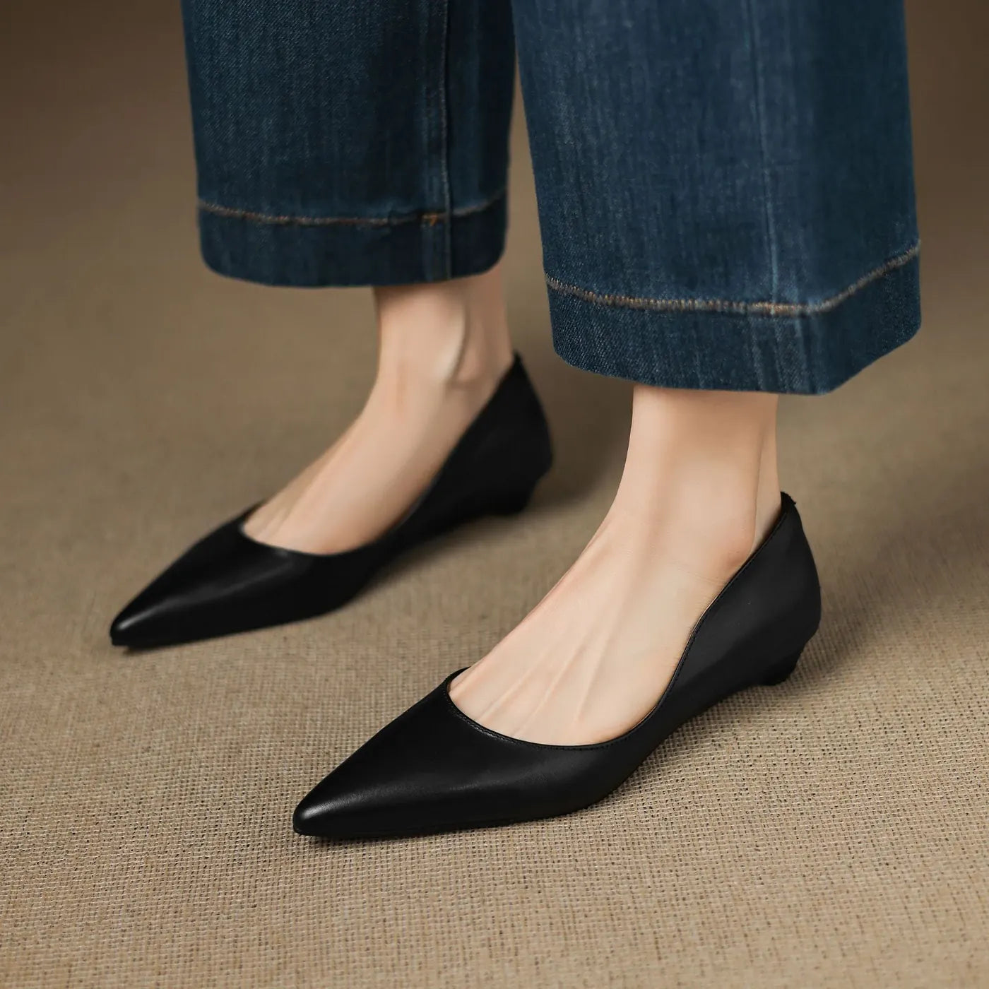 Black Women's Pointed Toe Leather Flats — Marielle Cushioned Wedge Heel - Close Up Worn Front