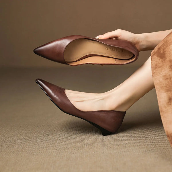 Brown Women's Pointed Toe Leather Flats — Marielle Cushioned Wedge Heel - Hand Holding Shoe Side