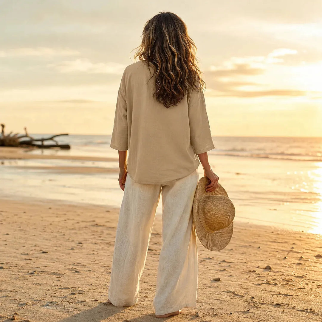 Khaki Women's V-Neck Linen Blouse — Elise Curved Hem Three-Quarter Sleeve Relaxed - Back Beach Pose