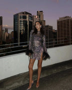 Black Women's Sequin Mini Party Dress — Una Feather Trim Bodycon - Rooftop Pose