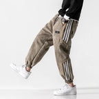 Men's Jogger Pants with Sherpa Lining & Striped Side Panels - Model Walking