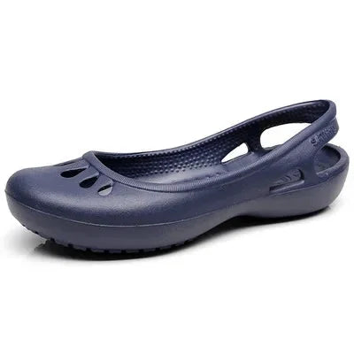 Blue Women's Waterproof Slingback Jelly Clogs — Trixie Rounded-Toe Cutout Flat - Studio Side Angle Navy