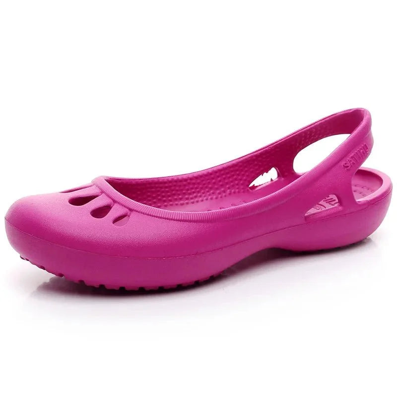 Pink Women's Waterproof Slingback Jelly Clogs — Trixie Rounded-Toe Cutout Flat - Studio Side Angle Magenta
