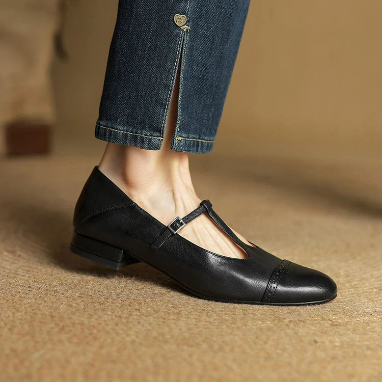 Black Women's T-Strap Mary Leather Flats — Hannah Buckle Cap-Toe - Worn Side Profile