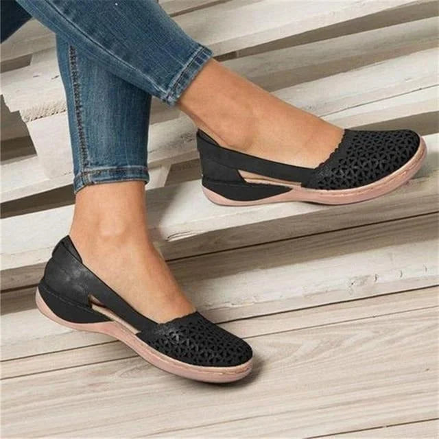 Black Women's Casual Wedge Flats — Tessa Faux Leather Cut-Out Slip-On - Angled View